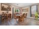 Cozy dining room with wood table and chairs, neutral walls, and natural lighting at 162 Sand Lake St, Henderson, NV 89074