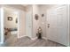 Bright foyer with wood-look floors features a front door and entry to the bonus room at 162 Sand Lake St, Henderson, NV 89074