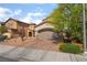 Charming two-story house boasts a two-car garage, desert landscaping, and a warm, inviting atmosphere at 162 Sand Lake St, Henderson, NV 89074