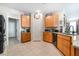 Efficient kitchen with granite counters, black appliances, and ample wood cabinet storage at 162 Sand Lake St, Henderson, NV 89074