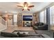 Inviting living room featuring a ceiling fan and entertainment center with shelving for media and books at 162 Sand Lake St, Henderson, NV 89074