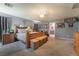 Serene primary bedroom featuring soft blue walls, carpeting, and ensuite bathroom at 162 Sand Lake St, Henderson, NV 89074