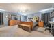 Spacious main bedroom featuring light blue walls, grey carpeting, and a full-size bed at 162 Sand Lake St, Henderson, NV 89074