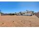 Spacious backyard with desert landscaping and block fence at 1620 Yellow Rose St, Las Vegas, NV 89108