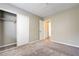 Bedroom with carpet flooring, a large closet, and a glimpse into the hallway at 1620 Yellow Rose St, Las Vegas, NV 89108