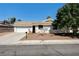 Charming single-story home featuring a well-manicured front yard and a two-car garage at 1620 Yellow Rose St, Las Vegas, NV 89108