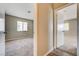 Hallway showing two carpeted bedrooms, neutral paint, white doors and trim, plus light wood-look flooring at 1620 Yellow Rose St, Las Vegas, NV 89108