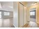Hallway featuring a large closet, wood-look flooring and connecting spaces at 1620 Yellow Rose St, Las Vegas, NV 89108