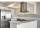 Modern kitchen features white cabinets, stainless steel appliances, and a sleek range hood at 1620 Yellow Rose St, Las Vegas, NV 89108
