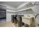 Laundry room features modern washer/dryer, shelving, and tile floors at 1620 Yellow Rose St, Las Vegas, NV 89108