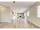 Open-concept living area with a decorative fireplace and wood-look flooring at 1620 Yellow Rose St, Las Vegas, NV 89108