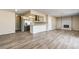 Bright open floor plan with modern kitchen, stainless appliances and cozy fireplace at 1620 Yellow Rose St, Las Vegas, NV 89108