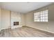 Cozy living room showcasing a tile fireplace and stylish wood flooring at 1620 Yellow Rose St, Las Vegas, NV 89108
