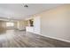 Bright living room with light gray wood floors flows into the open kitchen area at 1620 Yellow Rose St, Las Vegas, NV 89108
