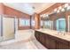 Bathroom featuring a soaking tub, a shower, dual vanities, and modern fixtures at 170 Wicked Wedge Way, Las Vegas, NV 89148
