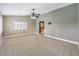 Spacious bedroom with neutral walls, plush carpet, ceiling fan and shuttered windows for plenty of natural light at 170 Wicked Wedge Way, Las Vegas, NV 89148