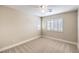 Bedroom with neutral walls, carpeted floors, and a ceiling fan at 170 Wicked Wedge Way, Las Vegas, NV 89148