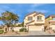 Charming two-story home with a two-car garage and desert landscaping at 170 Wicked Wedge Way, Las Vegas, NV 89148
