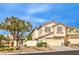 Charming two-story home with a two-car garage and desert landscaping at 170 Wicked Wedge Way, Las Vegas, NV 89148