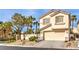 Charming two-story home with a two-car garage and desert landscaping at 170 Wicked Wedge Way, Las Vegas, NV 89148