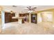 Open-concept kitchen and living area with an island and stainless steel appliances at 170 Wicked Wedge Way, Las Vegas, NV 89148