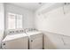 Laundry room with a window and wire shelving at 170 Wicked Wedge Way, Las Vegas, NV 89148