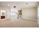 Large second-floor living area with plush carpet, white railing, and natural light throughout the space at 170 Wicked Wedge Way, Las Vegas, NV 89148