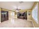 Spacious living room with tile flooring, ceiling fan, and plantation shutters at 170 Wicked Wedge Way, Las Vegas, NV 89148