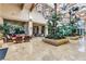 Grand lobby with soaring ceilings, skylights, tropical plants, and comfortable seating at 170 Wicked Wedge Way, Las Vegas, NV 89148