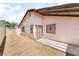 Backyard features a covered patio and desert landscaping at 1729 Yellow Rose St, Las Vegas, NV 89108