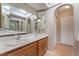 Bathroom featuring double sinks, framed mirrors, and closet for storage space at 1729 Yellow Rose St, Las Vegas, NV 89108