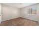 Bedroom with carpeted floors, window and white trim at 1729 Yellow Rose St, Las Vegas, NV 89108