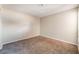 Carpeted bedroom with minimal design and a neutral color palette at 1729 Yellow Rose St, Las Vegas, NV 89108