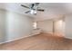 Open-concept living room with hardwood floors, ceiling fan, and neutral color scheme at 1729 Yellow Rose St, Las Vegas, NV 89108