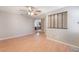 Living room with hardwood floors, open layout, ceiling fan, and lots of natural light at 1729 Yellow Rose St, Las Vegas, NV 89108