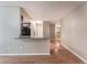 Bright living space with hardwood floors, a pass-through counter, and neutral paint at 1729 Yellow Rose St, Las Vegas, NV 89108