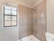 Shower stall with tiled walls and a window at 1729 Yellow Rose St, Las Vegas, NV 89108
