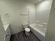 A bathroom features a tub and shower combination, a toilet, and a single sink at 1906 Arietta Vista St, Henderson, NV 89044