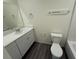 A bathroom features a toilet, a tub with a shower, and a single sink with a vanity at 1906 Arietta Vista St, Henderson, NV 89044