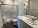 A modern bathroom with a glass-enclosed shower and sleek vanity at 1906 Arietta Vista St, Henderson, NV 89044