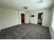 This carpeted bedroom features neutral walls and an en-suite bathroom at 1906 Arietta Vista St, Henderson, NV 89044