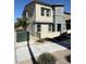 Modern two-story home featuring neutral-tone stucco, trimmed windows, and xeriscaping at 1906 Arietta Vista St, Henderson, NV 89044