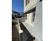 Modern two-story home featuring neutral-tone stucco, trimmed windows, and small rear patio at 1906 Arietta Vista St, Henderson, NV 89044