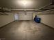 The garage is well lit and ready for parking cars and storing belongings with overhead storage at 1906 Arietta Vista St, Henderson, NV 89044