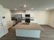 Modern kitchen featuring a center island, stainless steel appliances, and recessed lighting at 1906 Arietta Vista St, Henderson, NV 89044