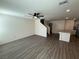 Spacious living room featuring a ceiling fan, wood-look floors, and an open floor plan at 1906 Arietta Vista St, Henderson, NV 89044