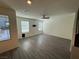 Open living area with recessed lighting, ceiling fan, and wood-look flooring at 1906 Arietta Vista St, Henderson, NV 89044
