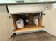 The home has plumbing for filtered water, including a filter and water storage, under the kitchen sink at 1906 Arietta Vista St, Henderson, NV 89044