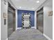 Hallway with elevators and a mirror with black-and-white mosaic frame, stylish flooring and design at 200 W Sahara Ave # 603, Las Vegas, NV 89102