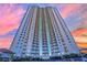 Stunning high-rise condo building with a sleek design and beautiful sunset backdrop at 200 W Sahara Ave # 603, Las Vegas, NV 89102